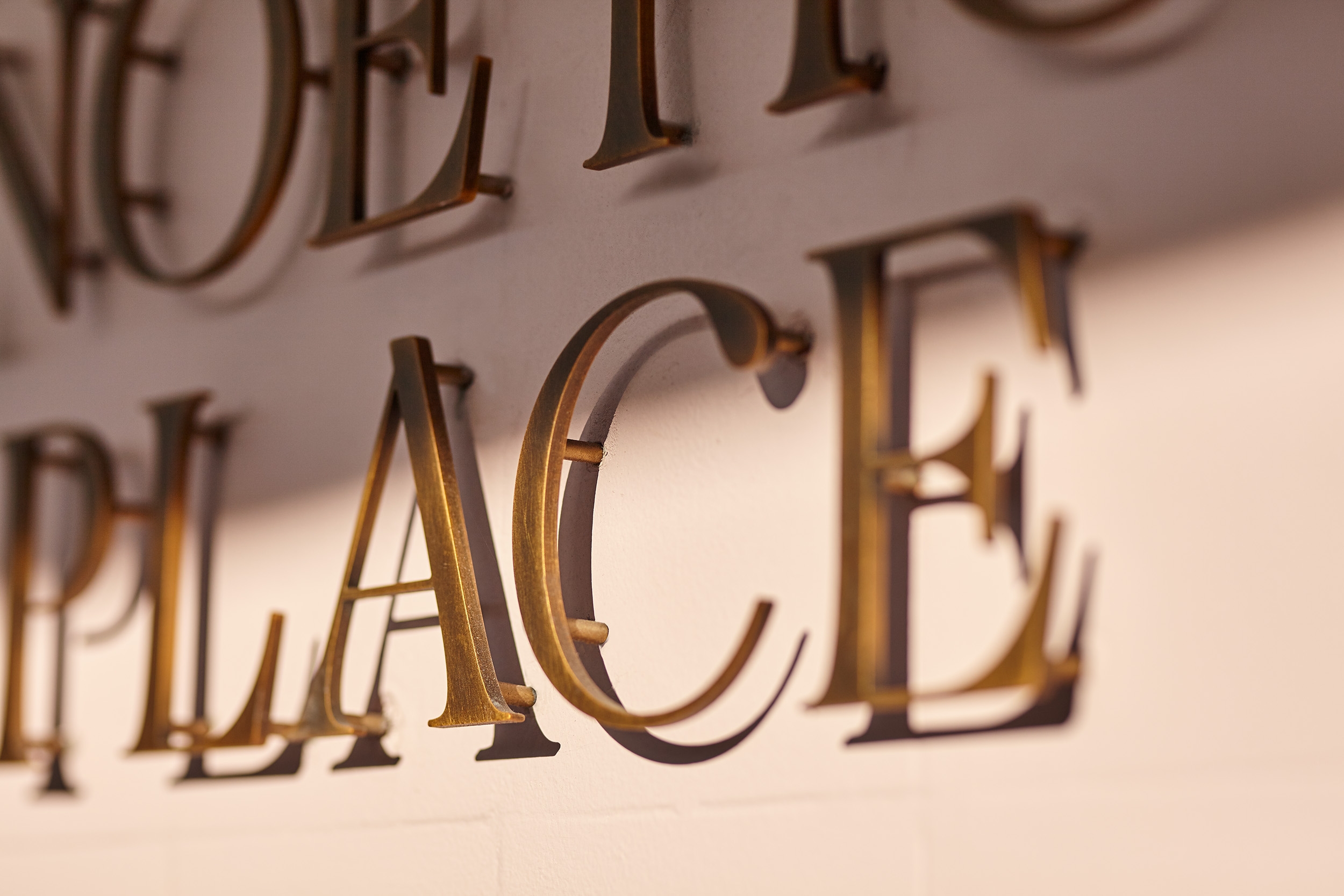 Noetic Place display suite signage by Seesaw Studio